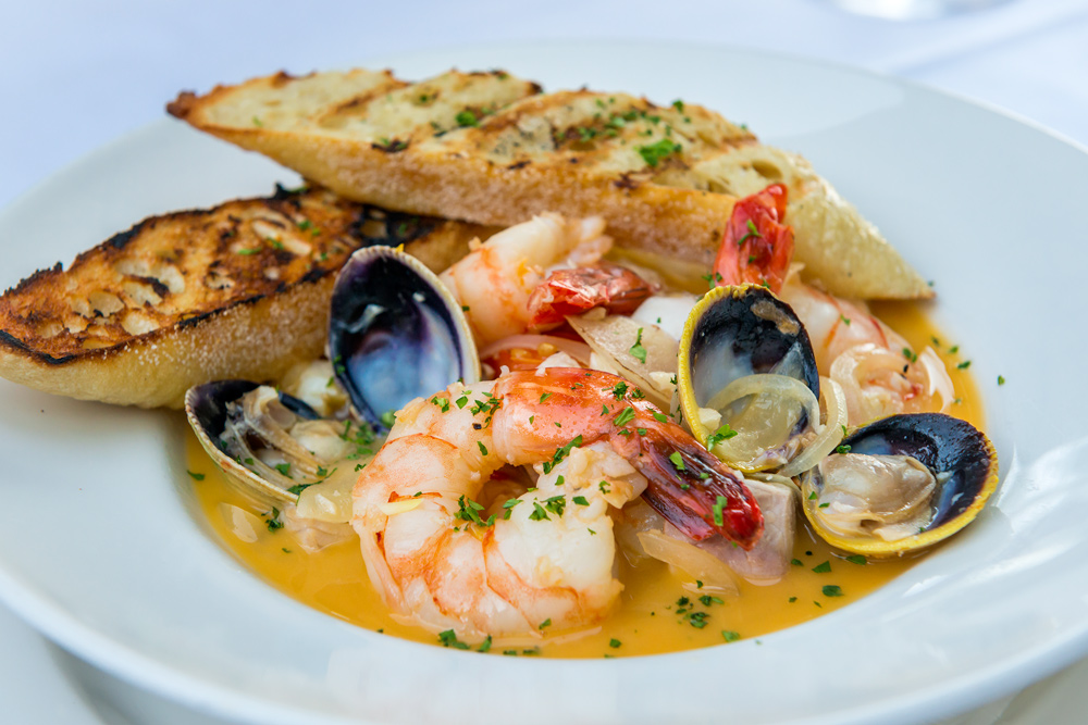 Nanea_2015-04-Web Seafood Bruschetta with fresh fish, shrimp, clams and scallops in a lemon butter sauce. Image ©2015 Daniel Lane