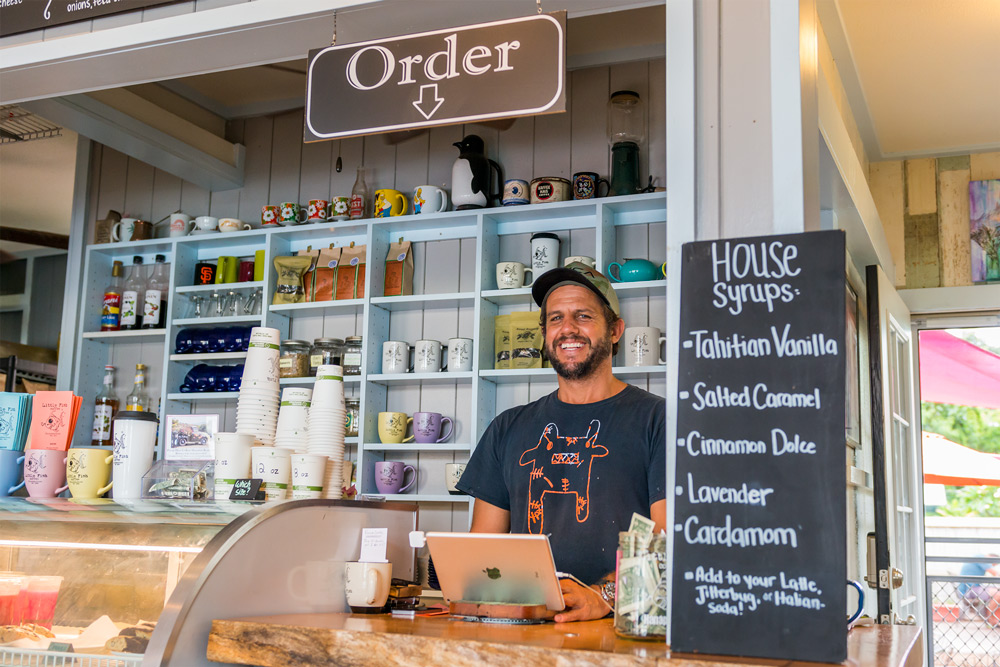 Ethan Page behind the counter at Little Fish Coffee. Daniel Lane photo.