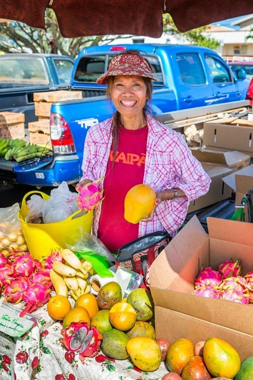 Linda Yoshii posing at her food stand on Kauai, Hawaii
