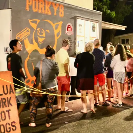 a group of people standing in front of a store