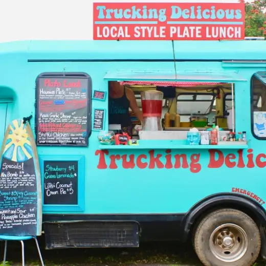 a truck is parked in front of a blue car